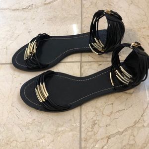 Black and gold Tory Burch ankle Sandals.